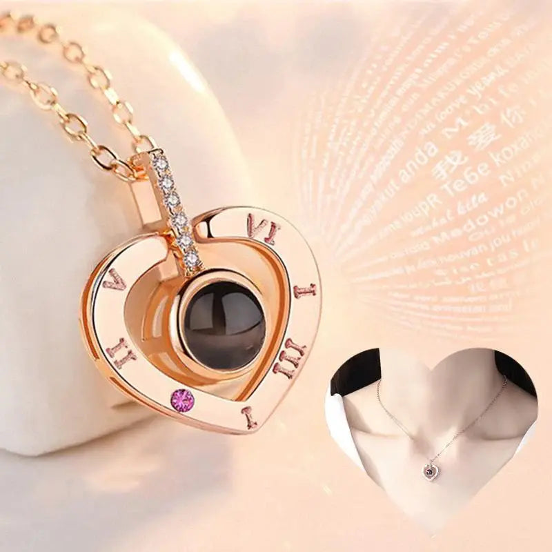 COFRE ROSA ETERNA 360° GIRATORIO + COLLAR CORAZÓN PROYECTOR DE 100 IDIOMAS ENCHAPADO EN ORO ROSE 14K